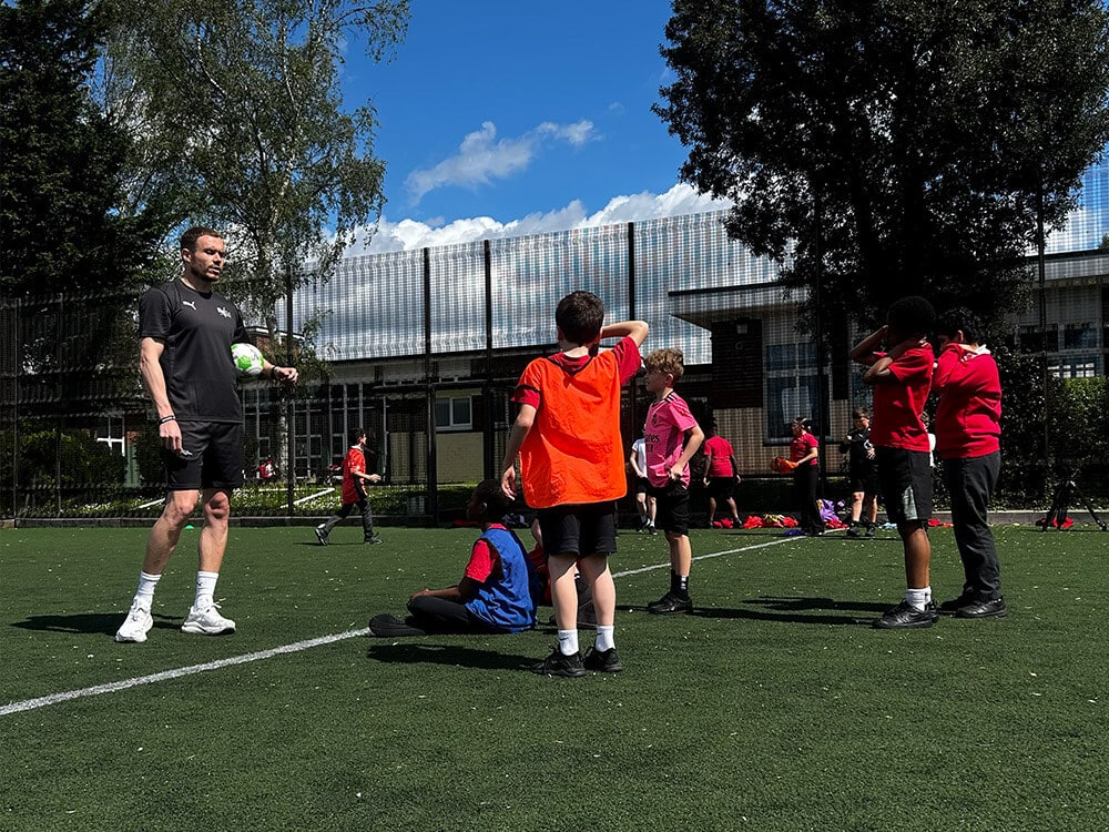 Mini Match Officials coach Leigh Doughty leading a school football refereeing workshop